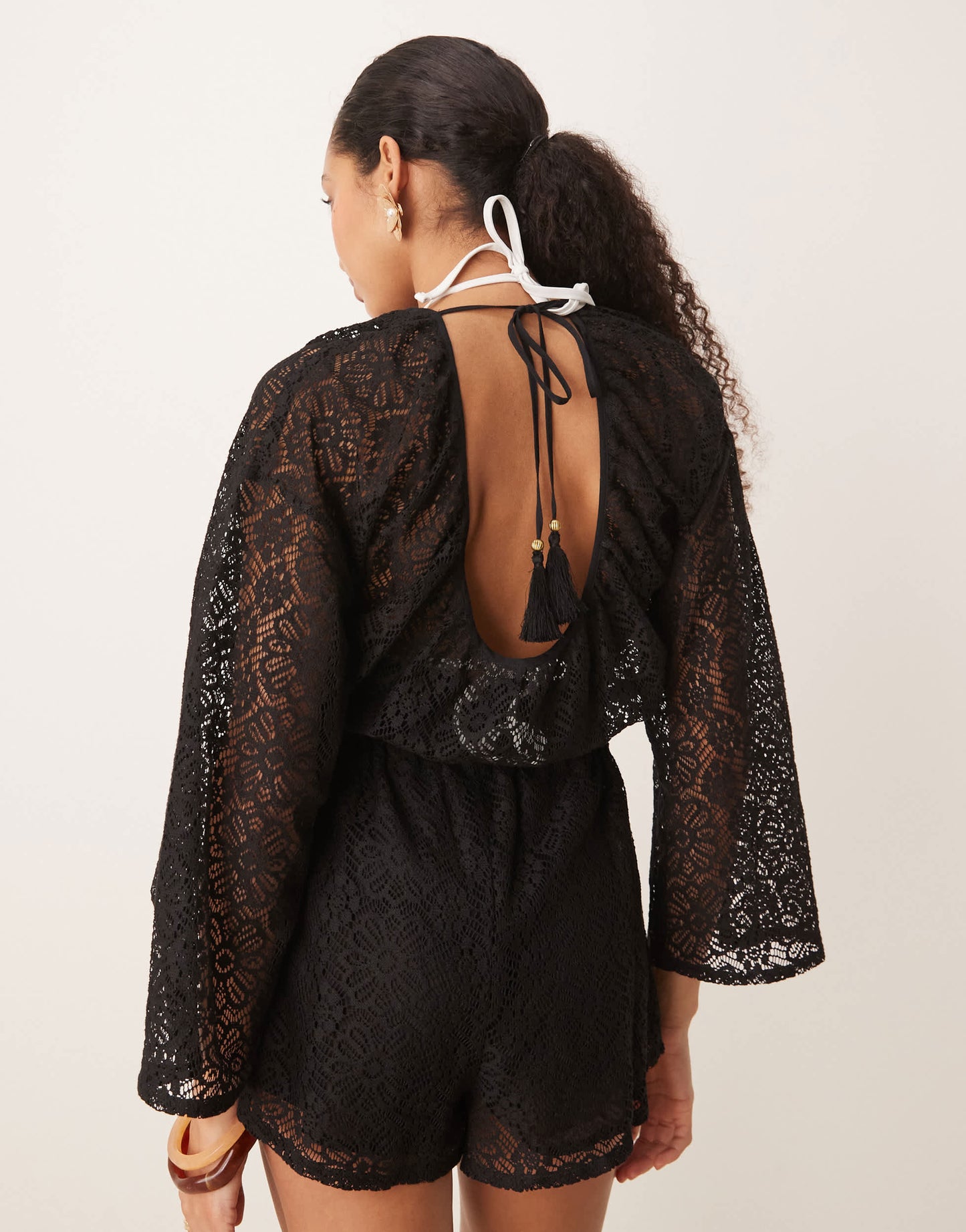 ASOS DESIGN crochet long sleeve mini playsuit with drawstring in black