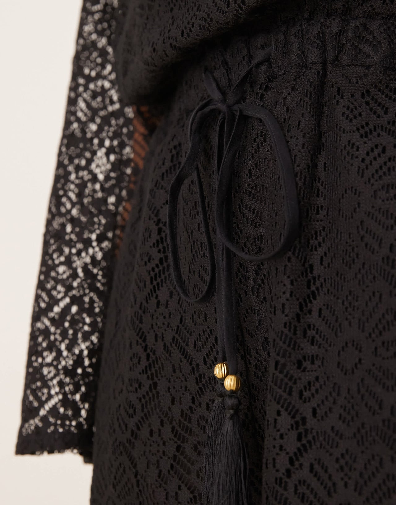ASOS DESIGN crochet long sleeve mini playsuit with drawstring in black