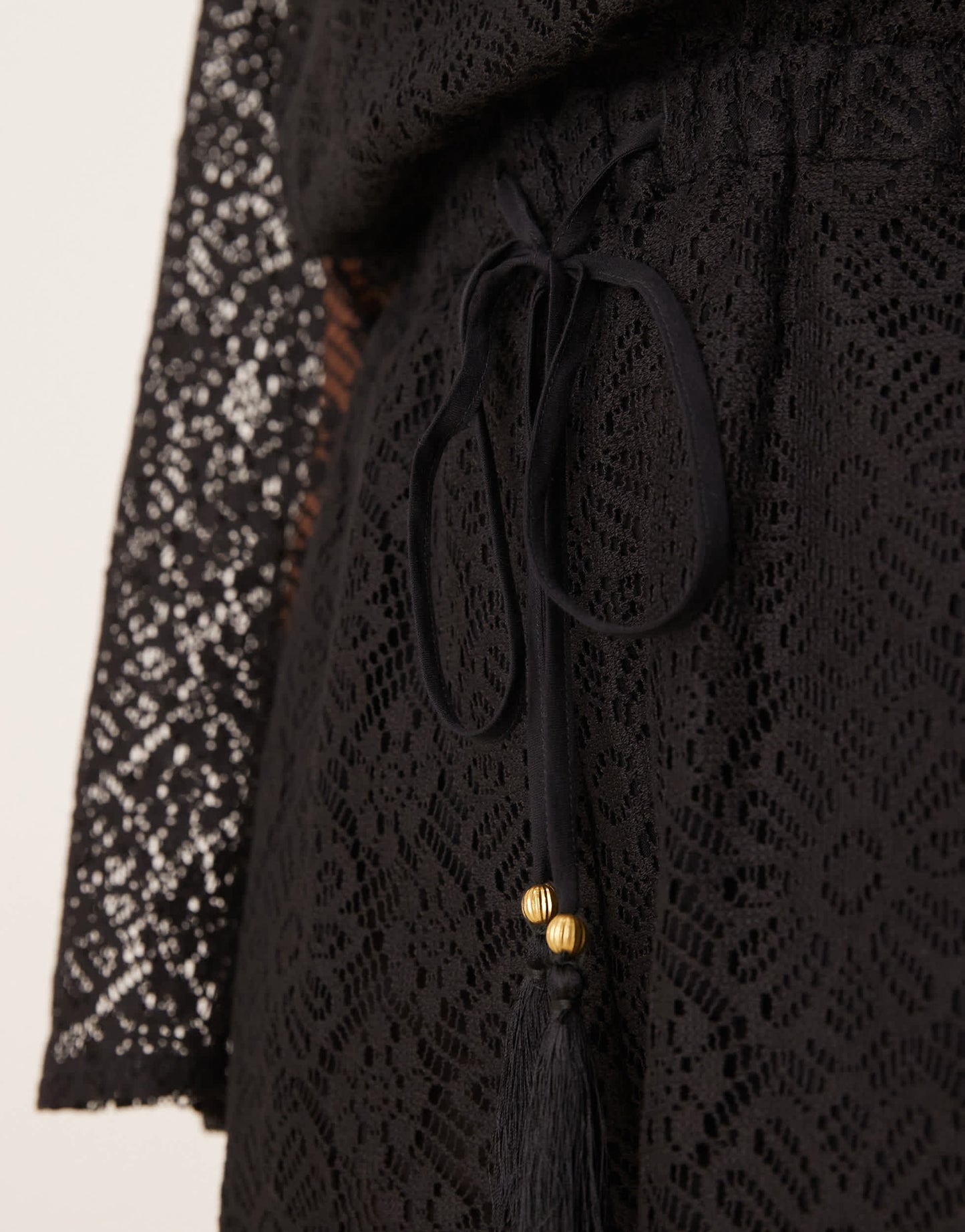 ASOS DESIGN crochet long sleeve mini playsuit with drawstring in black
