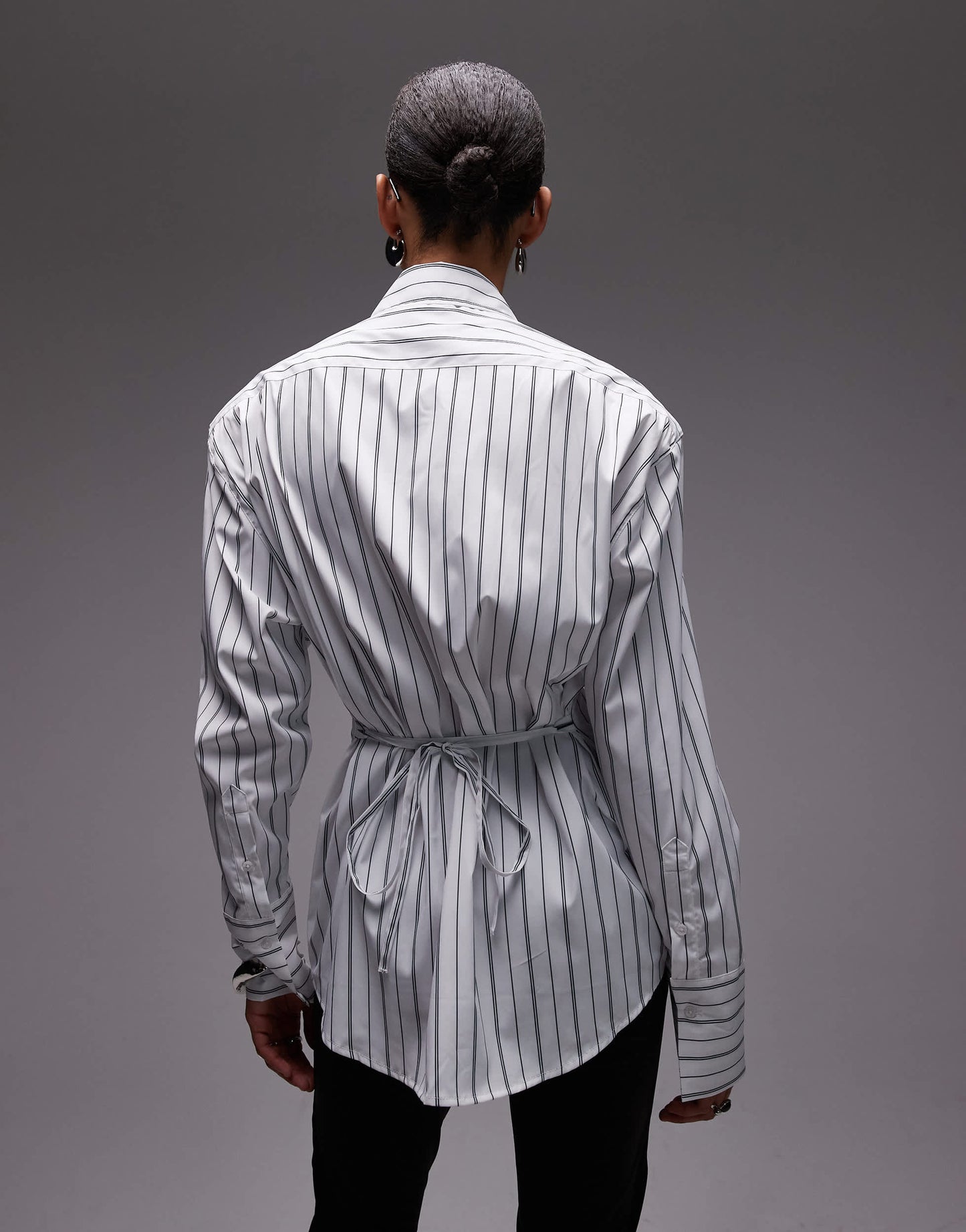 ASOS DESIGN cinch shoulder pad shirt with tie back in black pinstripe