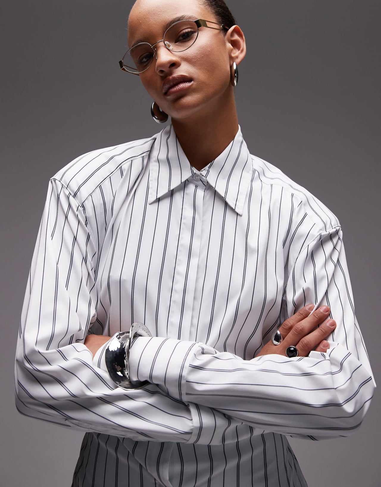 ASOS DESIGN cinch shoulder pad shirt with tie back in black pinstripe