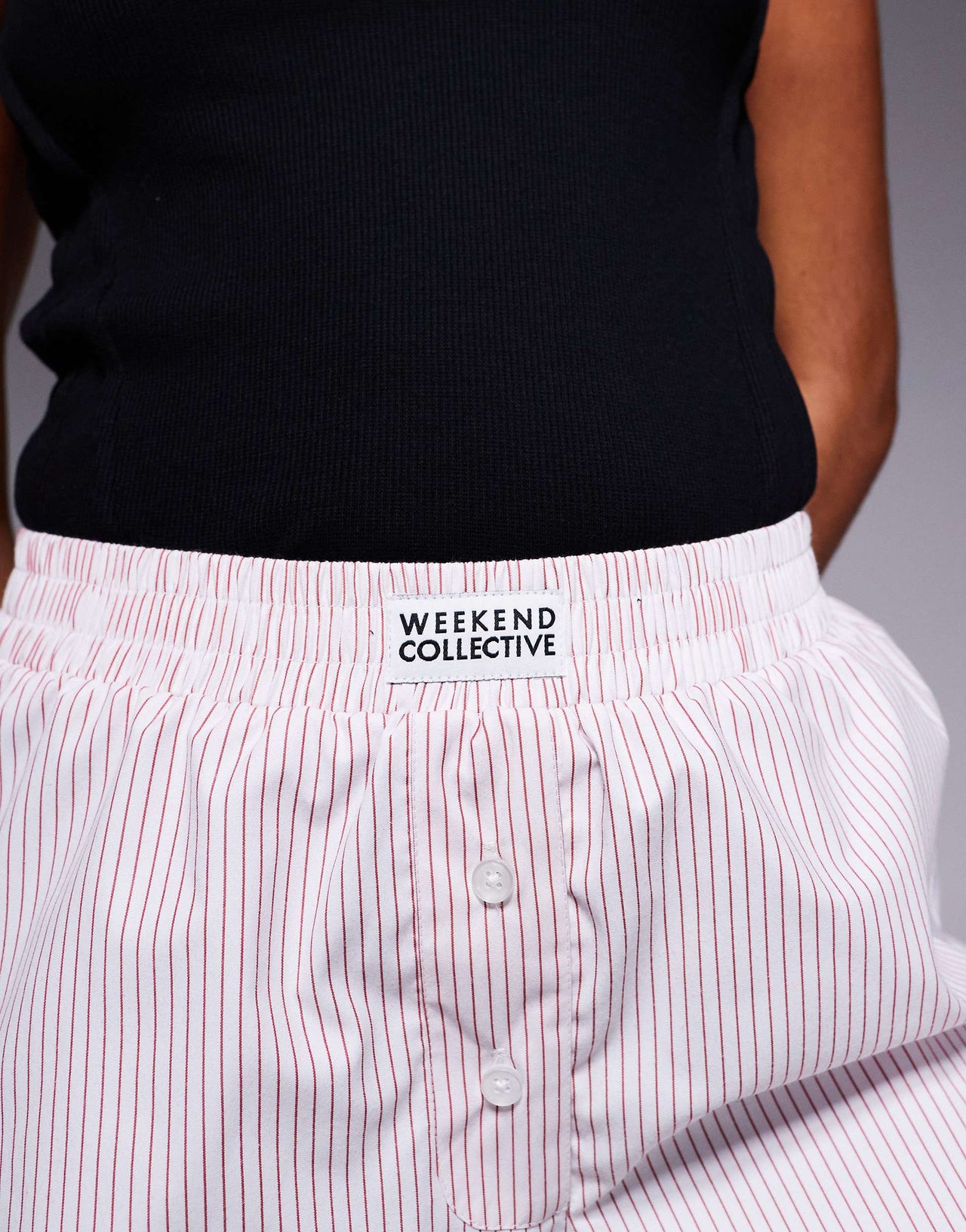 Weekend Collective woven short in red and white pinstripe
