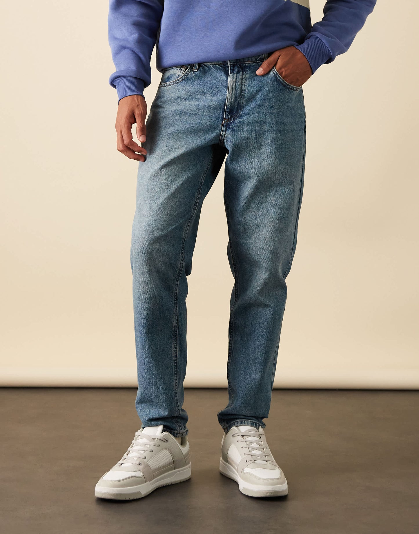 ASOS DESIGN tapered jeans in mid wash blue
