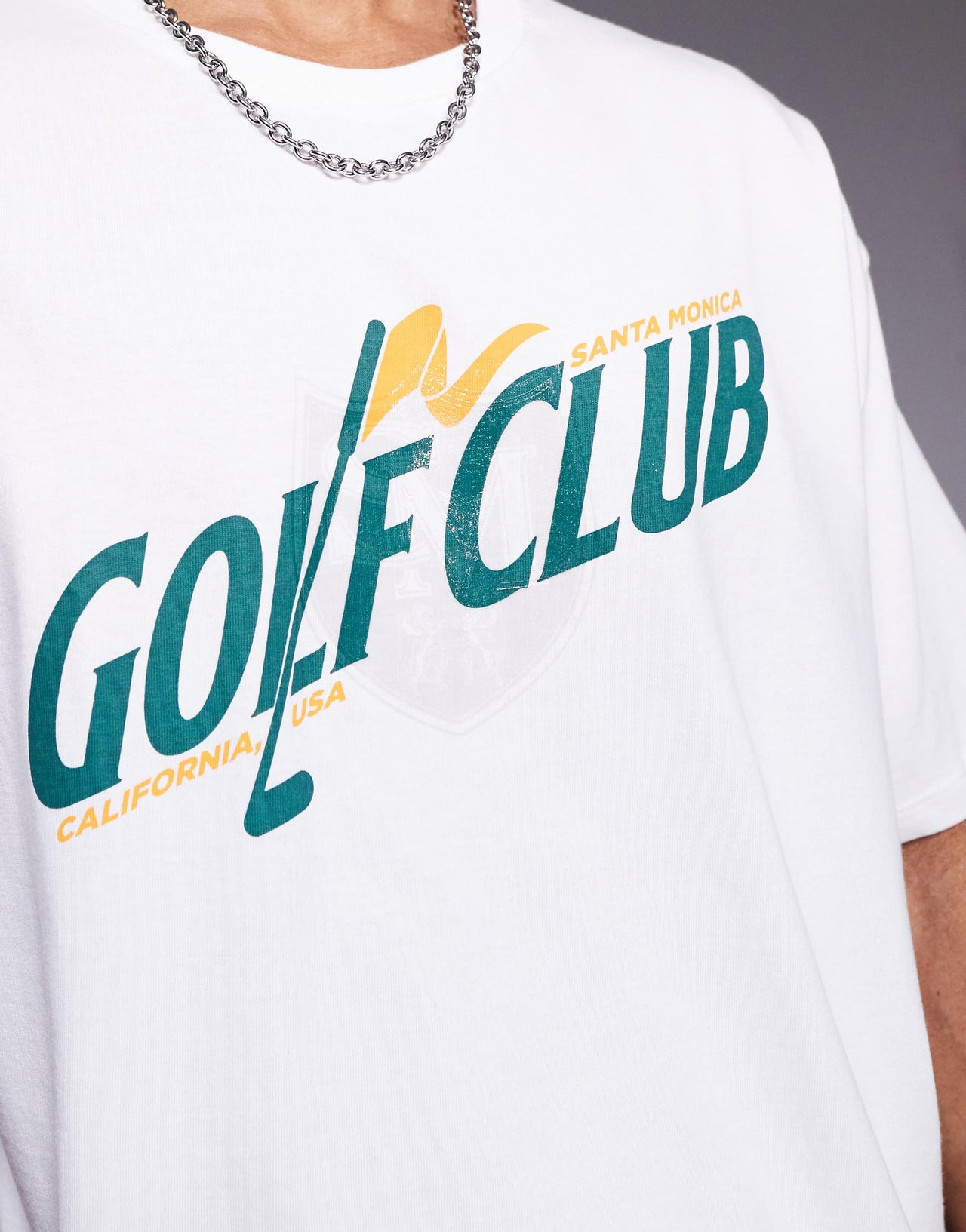 ASOS DESIGN boxy oversized t-shirt with golf graphic in white