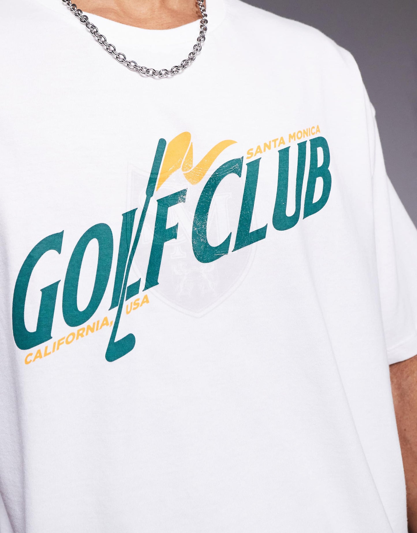 ASOS DESIGN boxy oversized t-shirt with golf graphic in white