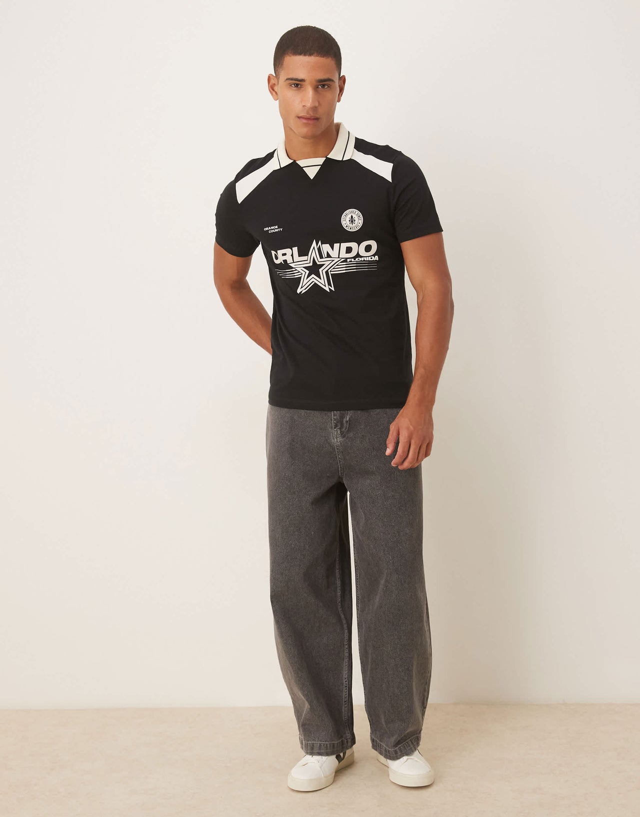 ASOS DESIGN polo with city graphic in black
