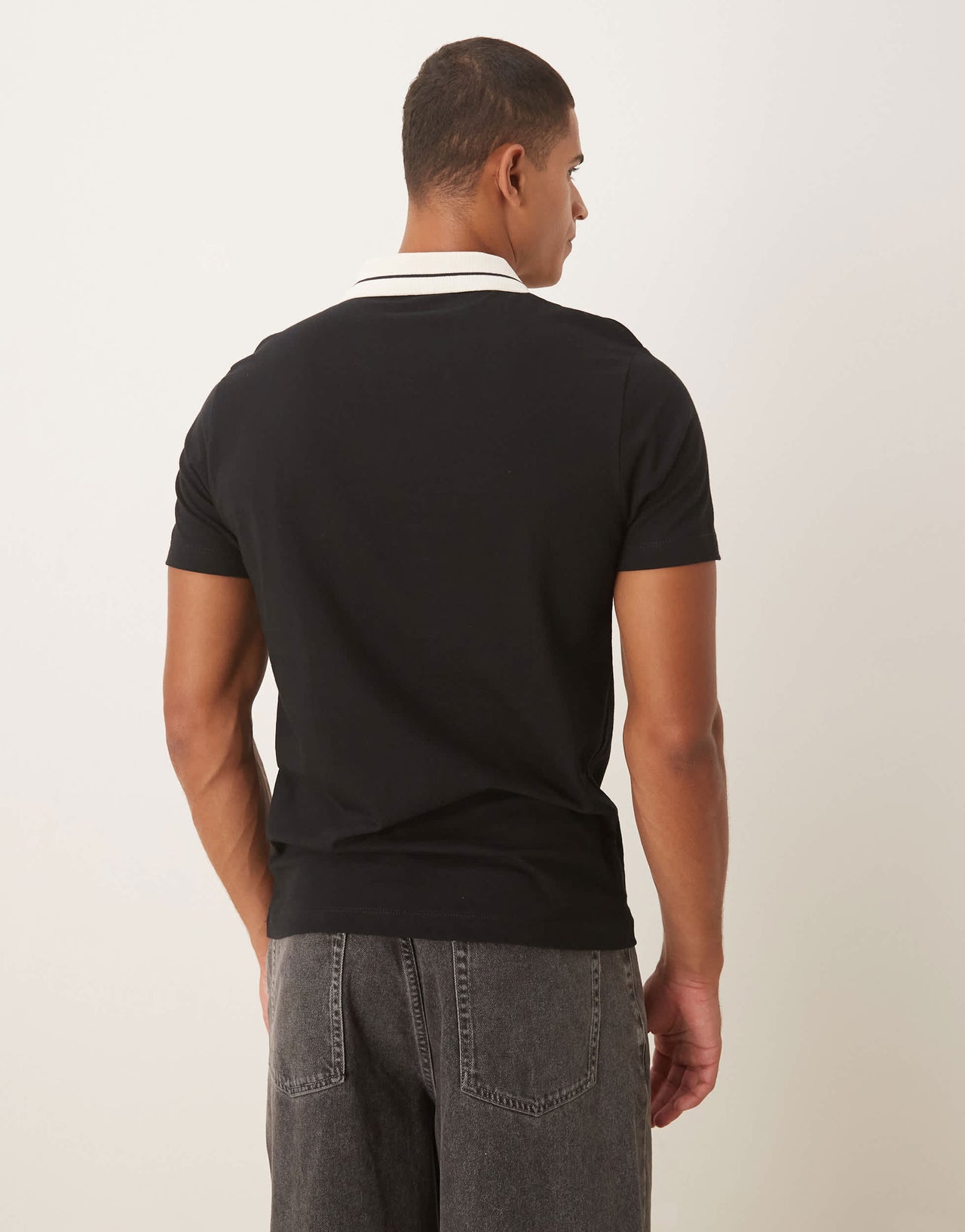ASOS DESIGN polo with city graphic in black