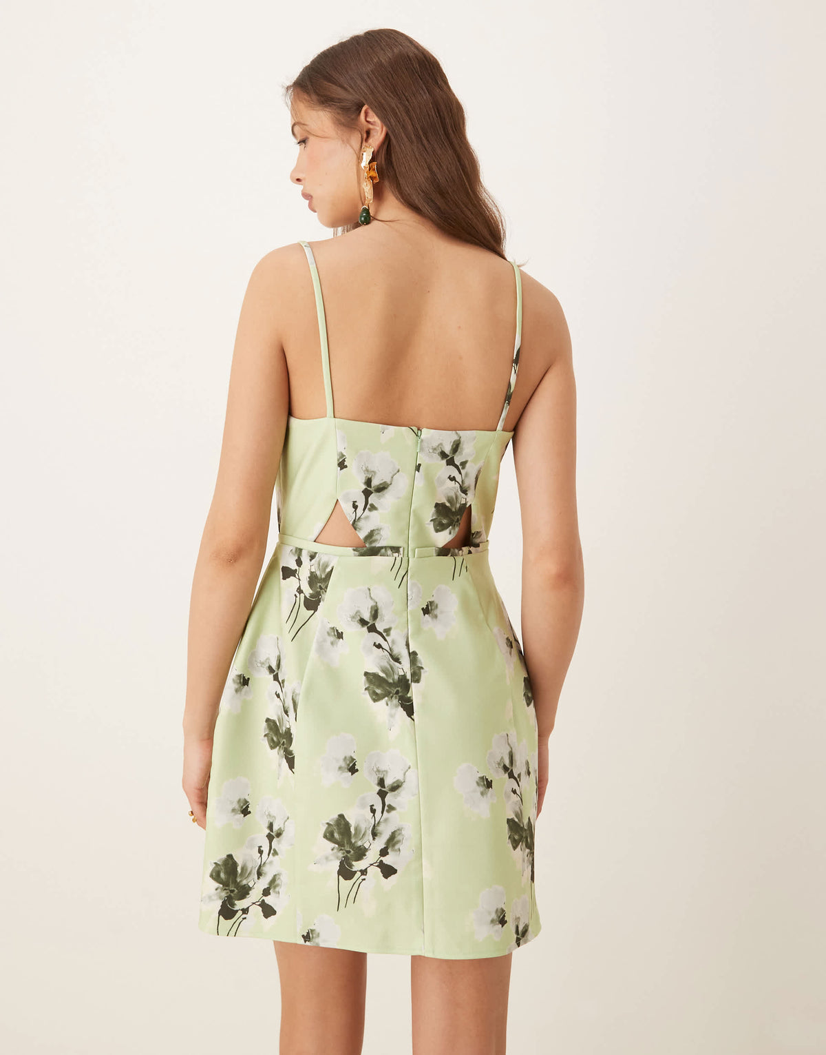 ASOS DESIGN structured cutout mini dress with bow in sage floral print