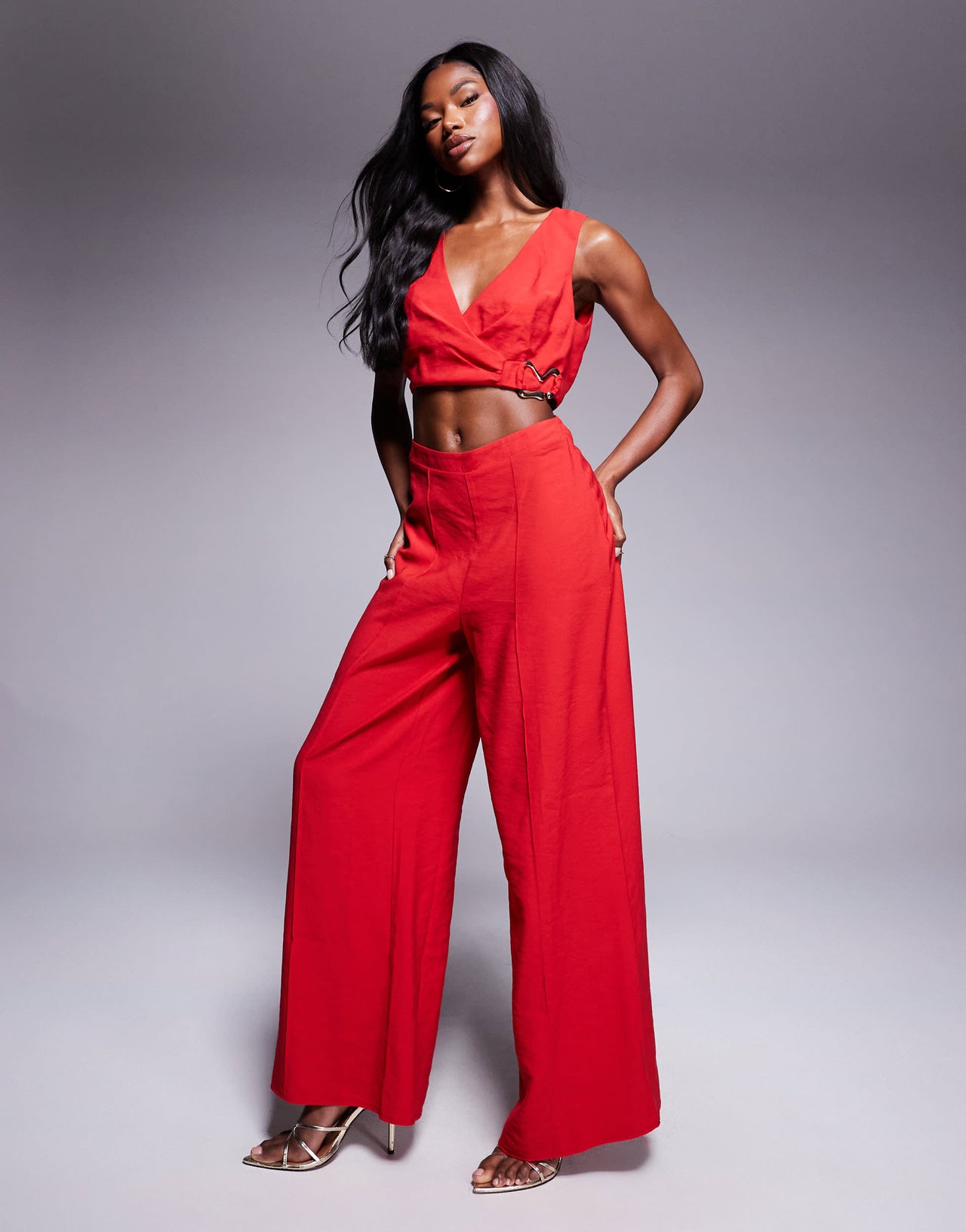 ASOS DESIGN wrap front cut out jumpsuit with buckle detail in red