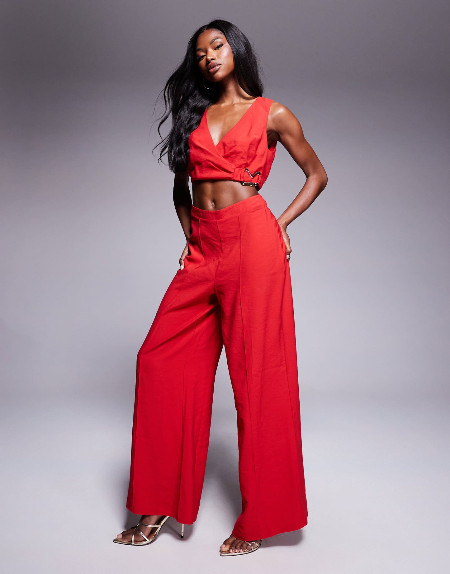 ASOS DESIGN wrap front cut out jumpsuit with buckle detail in red