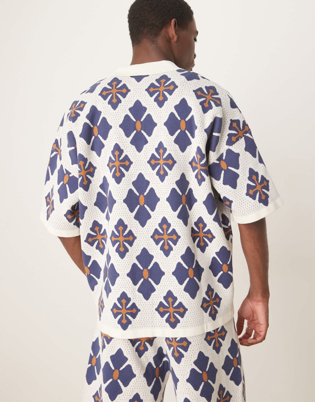 ASOS DESIGN relaxed knitted button through polo co-ord with aztec pattern in blue