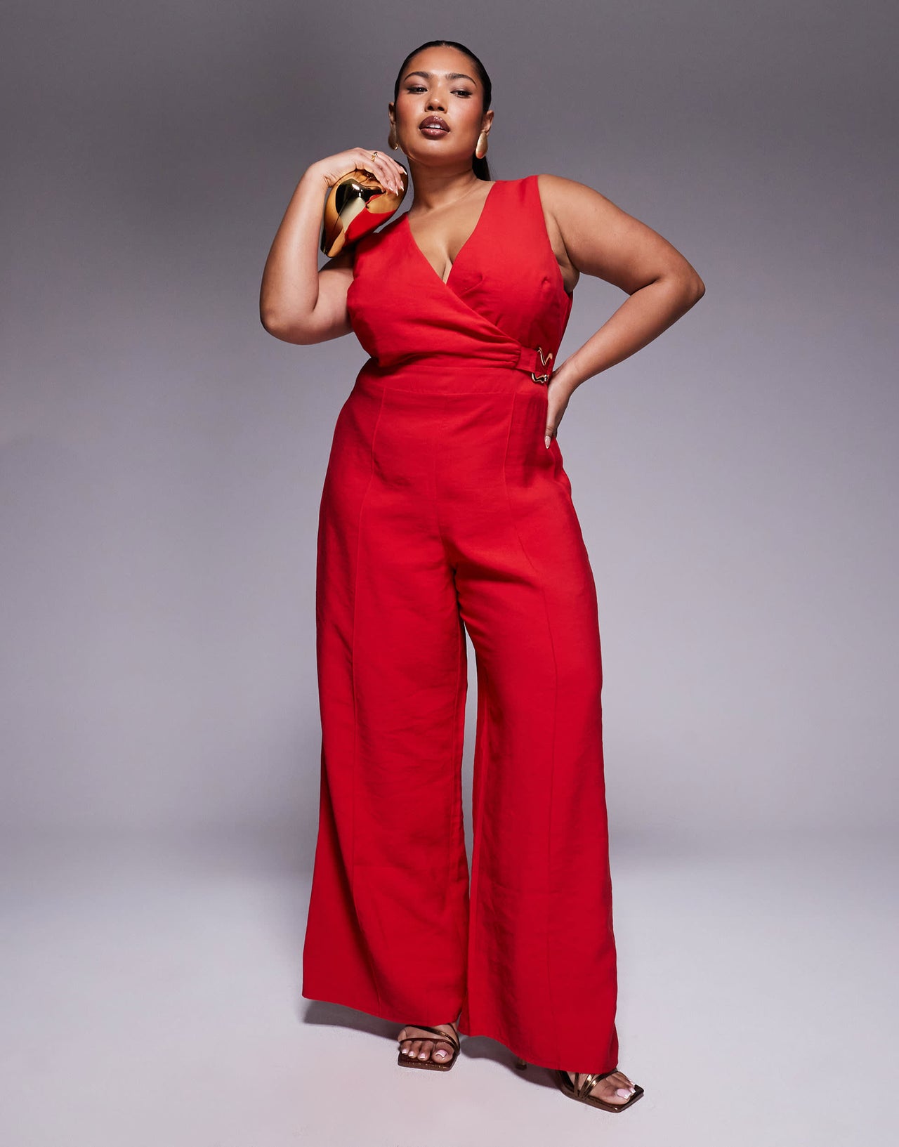 ASOS DESIGN Curve wrap front cut out jumpsuit with buckle detail in red