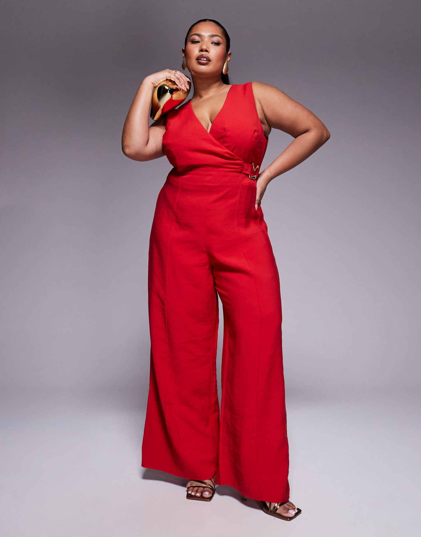 ASOS DESIGN Curve wrap front cut out jumpsuit with buckle detail in red