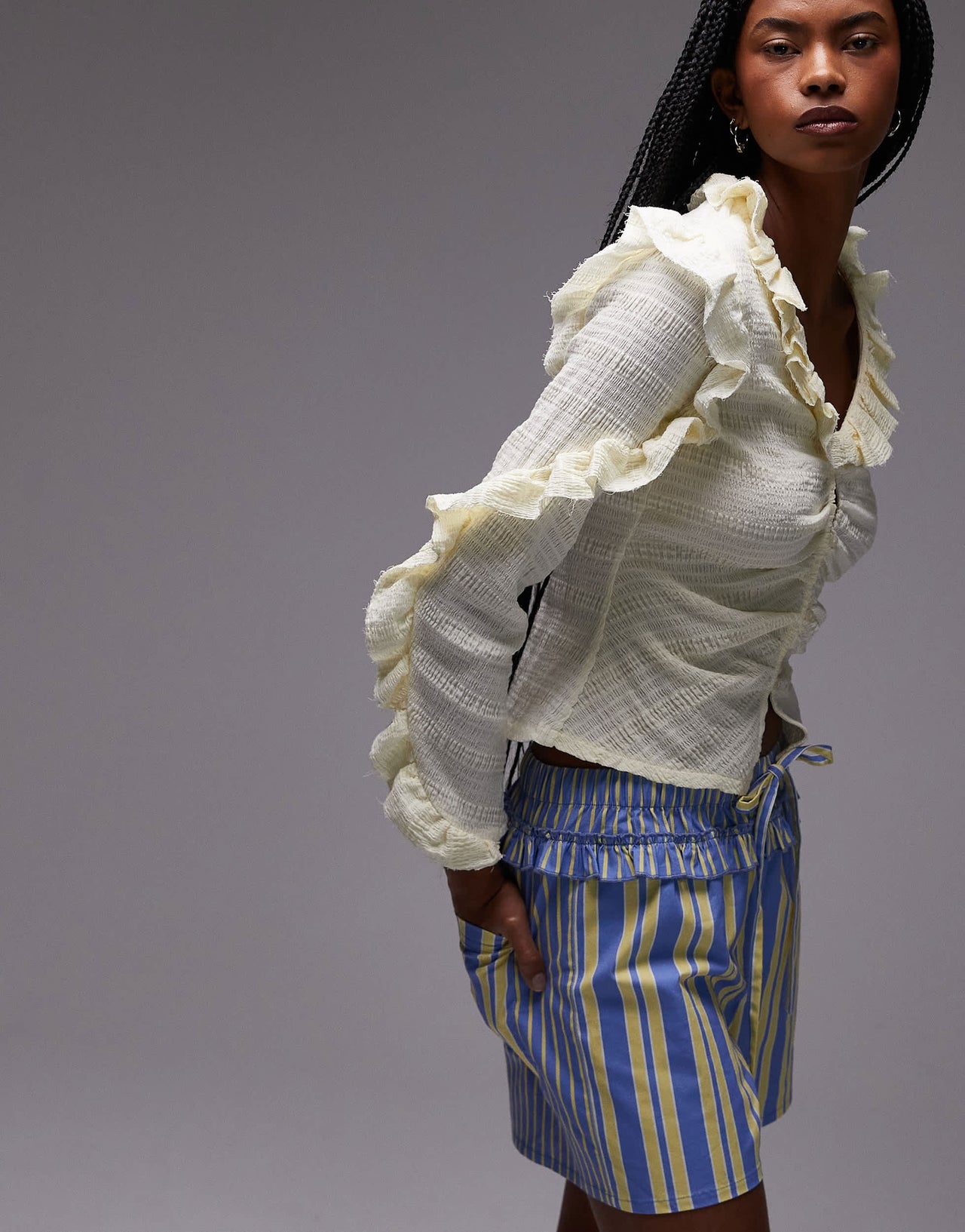 LAAGAM textured ruffle front button up blouse in white