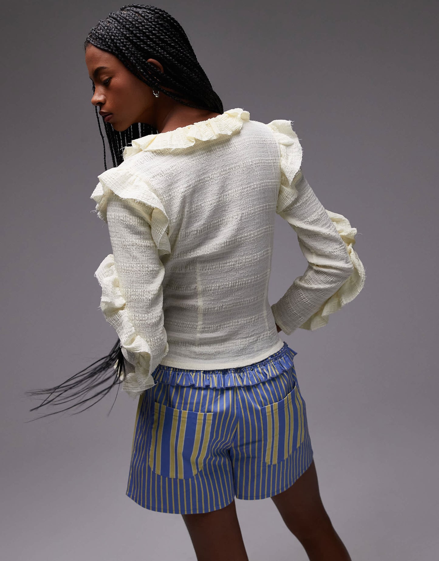 LAAGAM textured ruffle front button up blouse in white