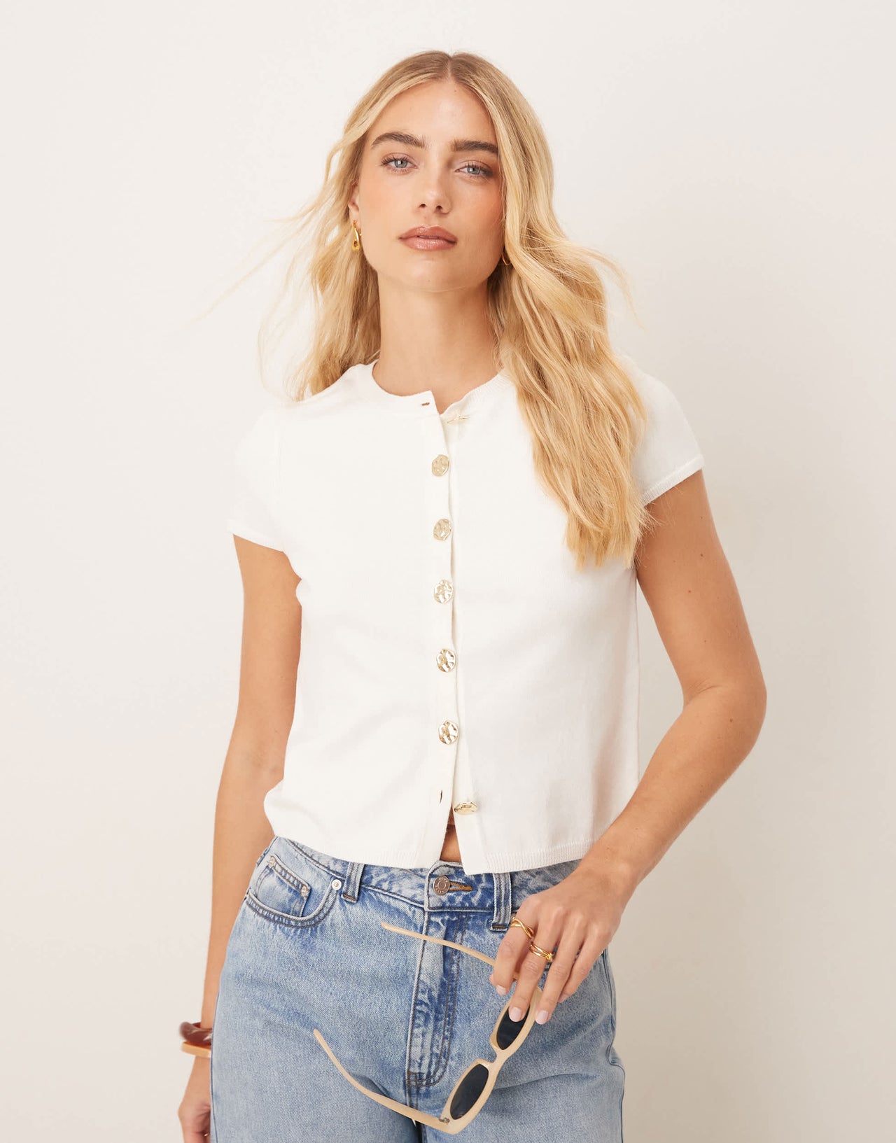 ASOS DESIGN knitted structured cap sleeve cardigan with gold buttons in cream