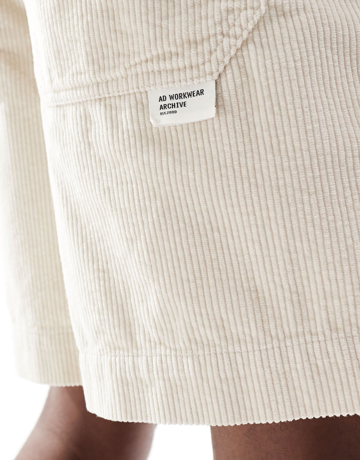 ASOS DESIGN corduroy shorts with workwear patch in stone