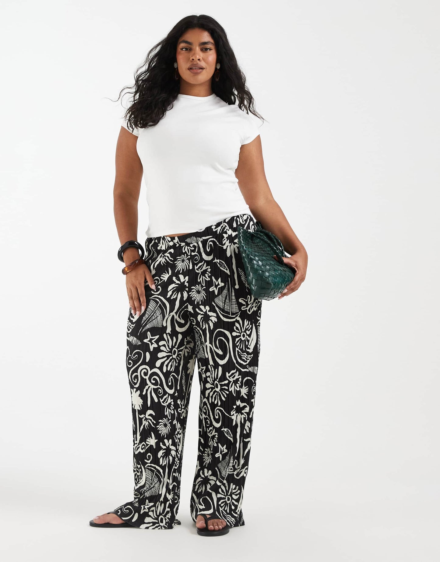 Vero Moda Curve high waist wide leg plisse trouser in tropical conversational print