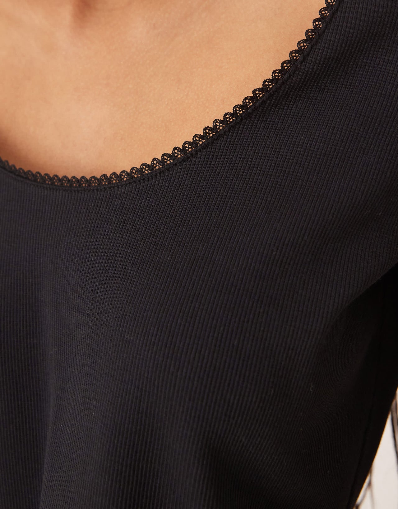 ASOS DESIGN ribbed long sleeve boxy crop top with trim detail in black