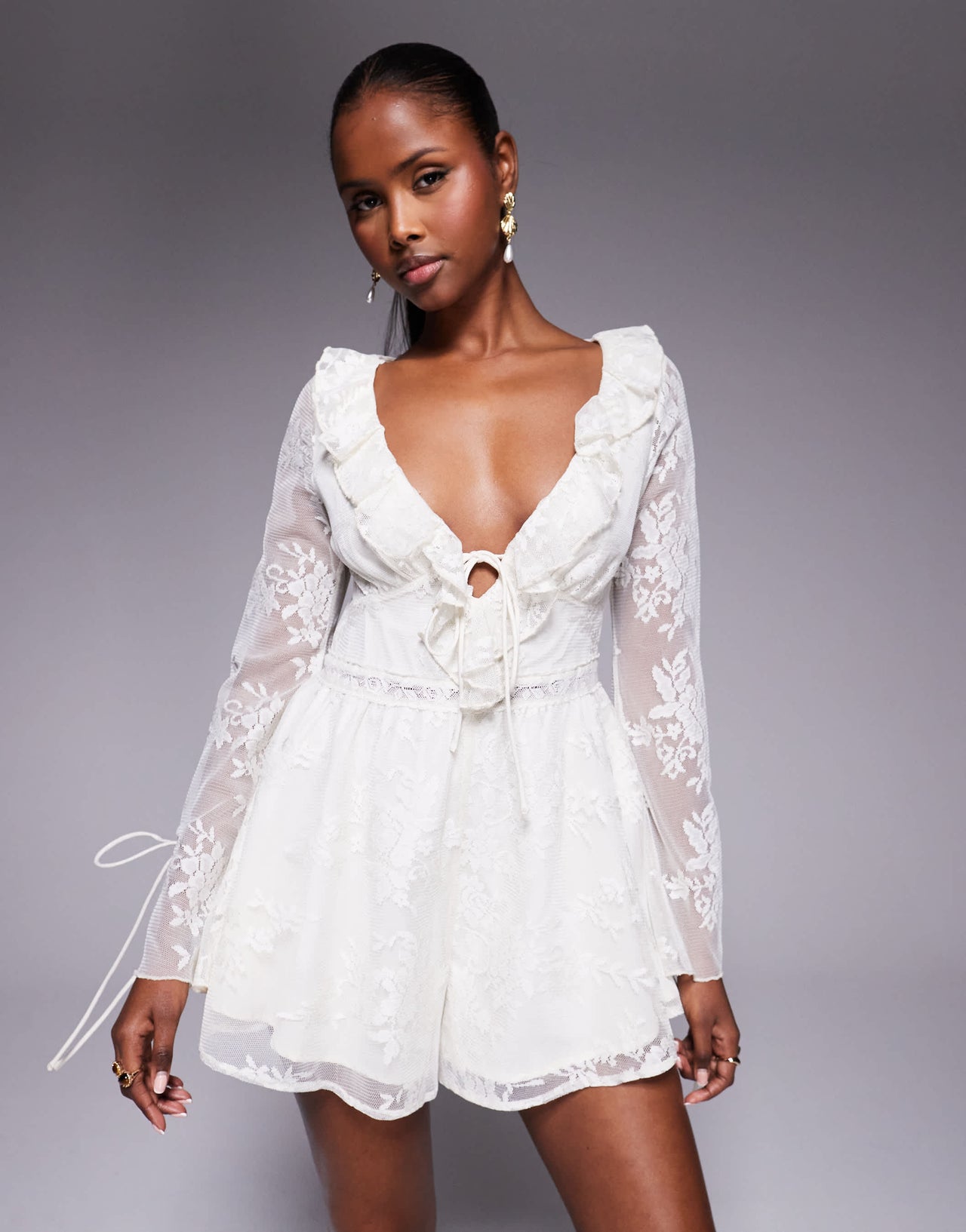 Love Triangle ruffle detail lace playsuit with tie detail in cream