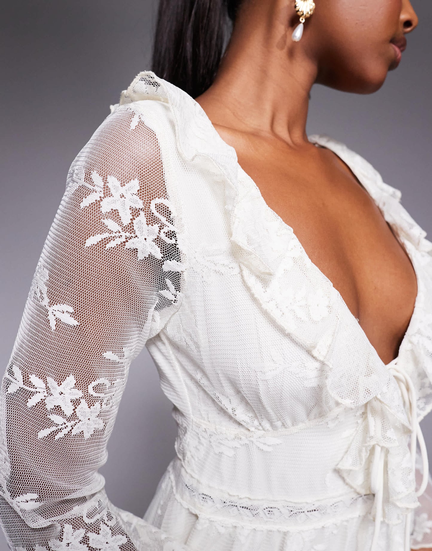 Love Triangle ruffle detail lace playsuit with tie detail in cream