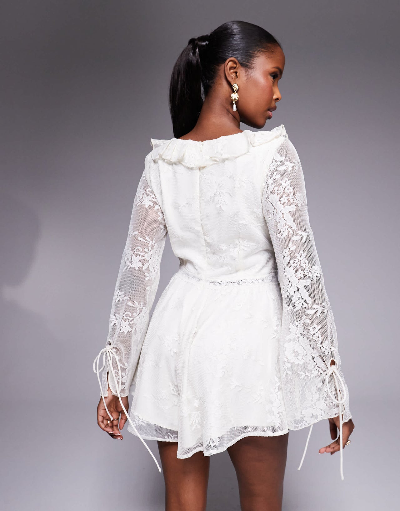 Love Triangle ruffle detail lace playsuit with tie detail in cream
