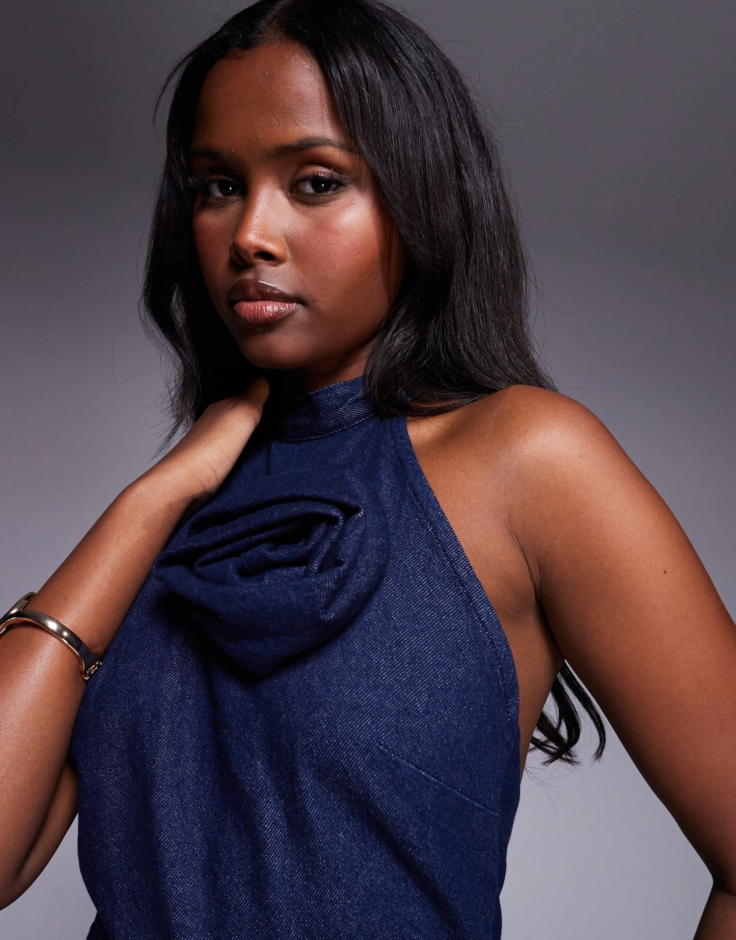 ASOS DESIGN denim halterneck mini dress with rose corsage