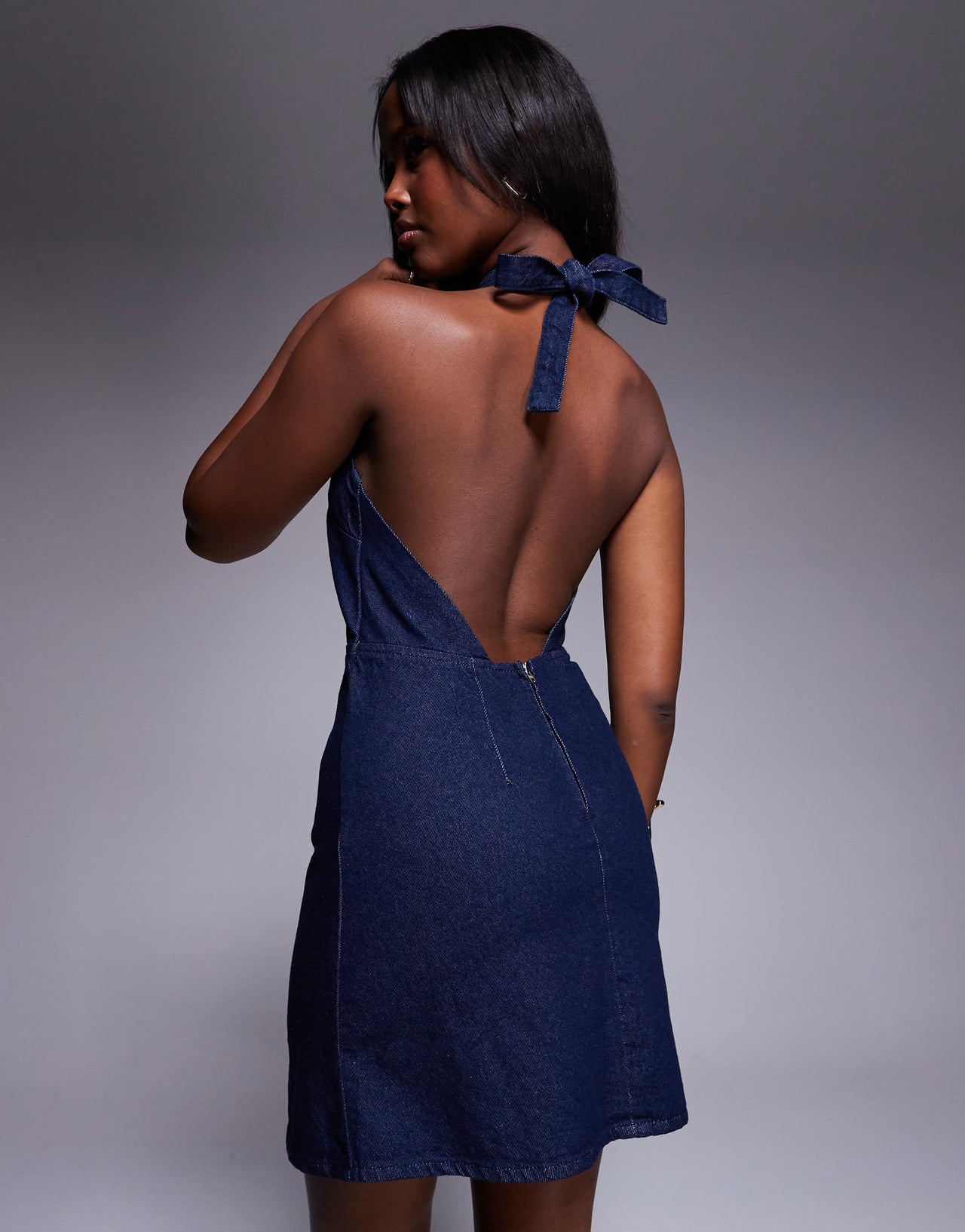 ASOS DESIGN denim halterneck mini dress with rose corsage