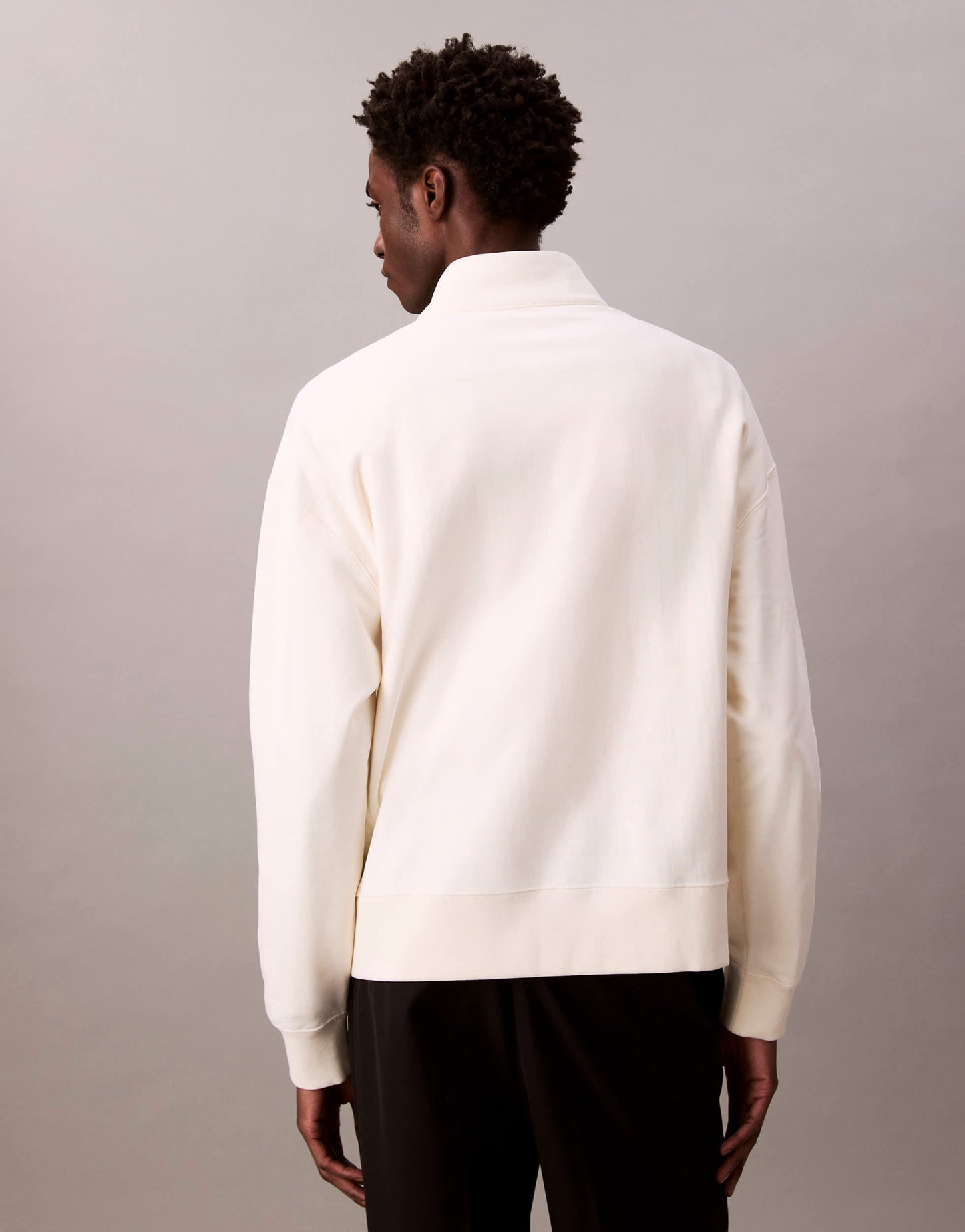Calvin Klein Jeans embroidered chest logo 1/4 zip sweatshirt in off white