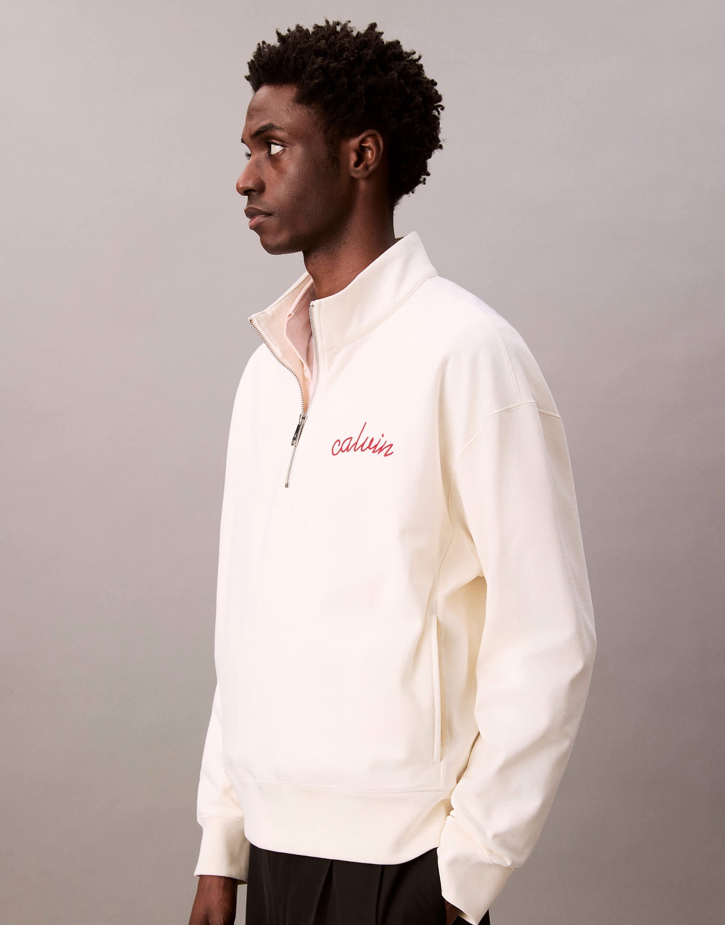 Calvin Klein Jeans embroidered chest logo 1/4 zip sweatshirt in off white