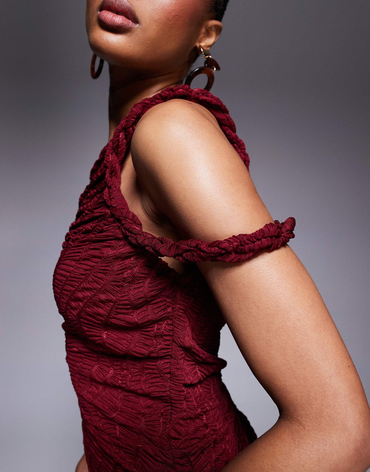 ASOS DESIGN Tall ruched asymmetric textured midi dress with twisted strapping details in dark cherry