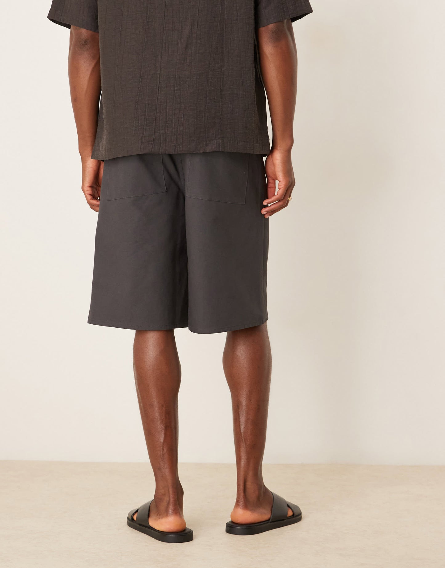 ASOS DESIGN long length pleated shorts in charcoal