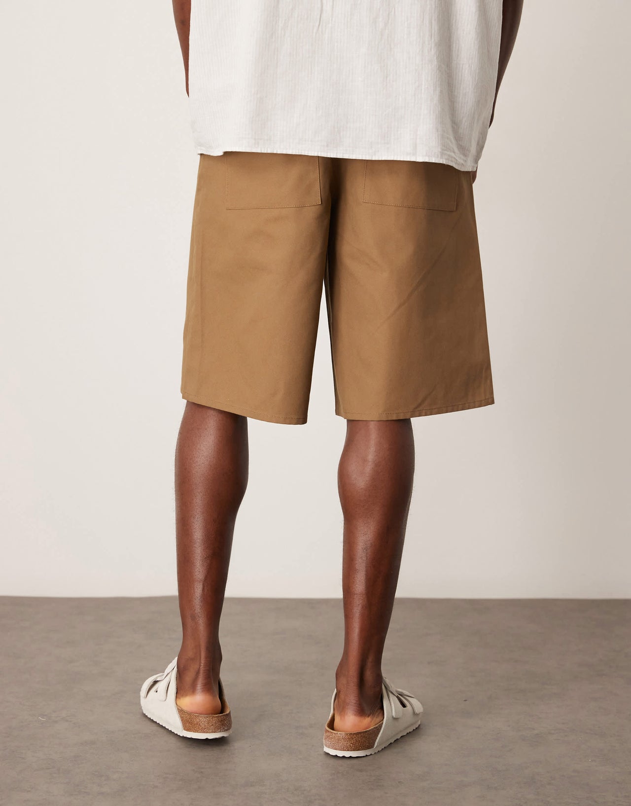 ASOS DESIGN long length pleated shorts in tan