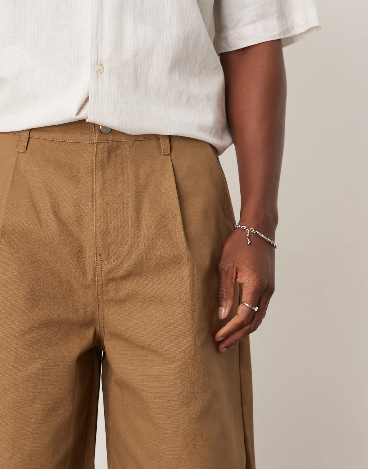 ASOS DESIGN long length pleated shorts in tan
