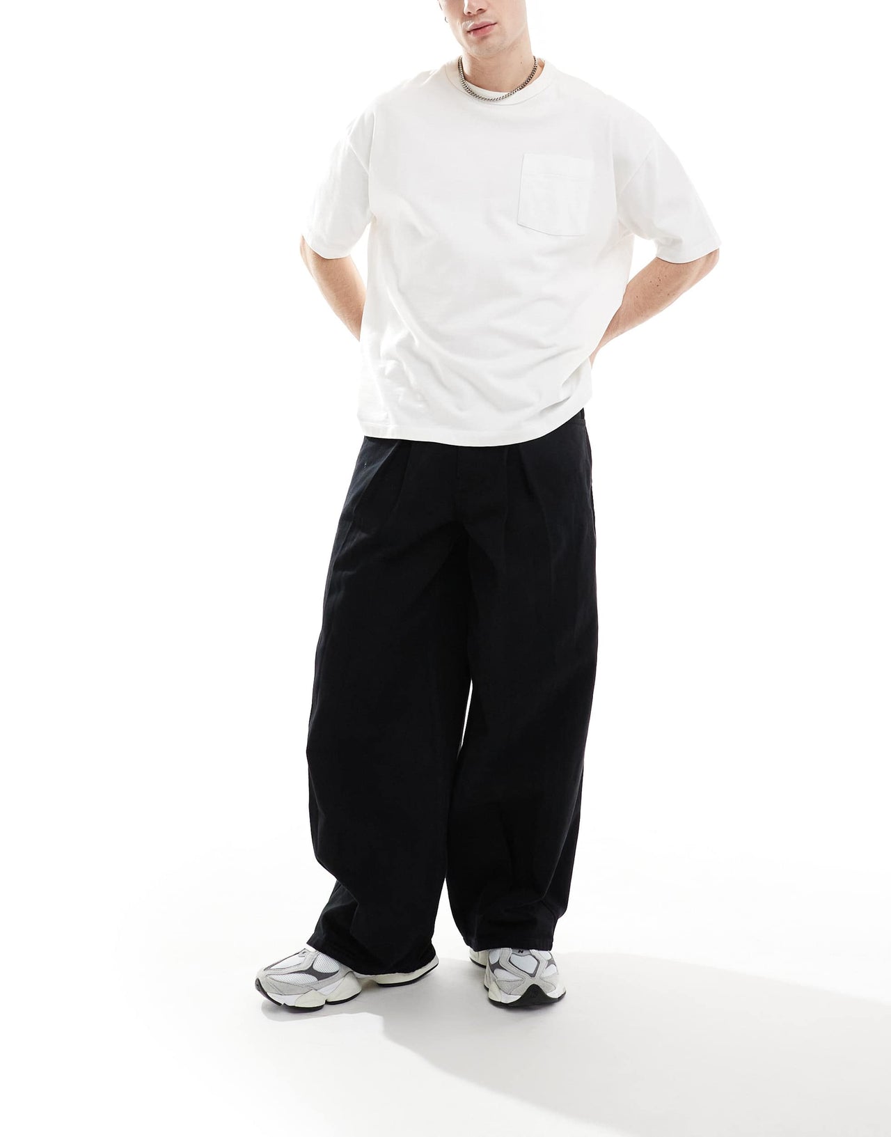 ASOS DESIGN loose trousers in black with pleat detailing