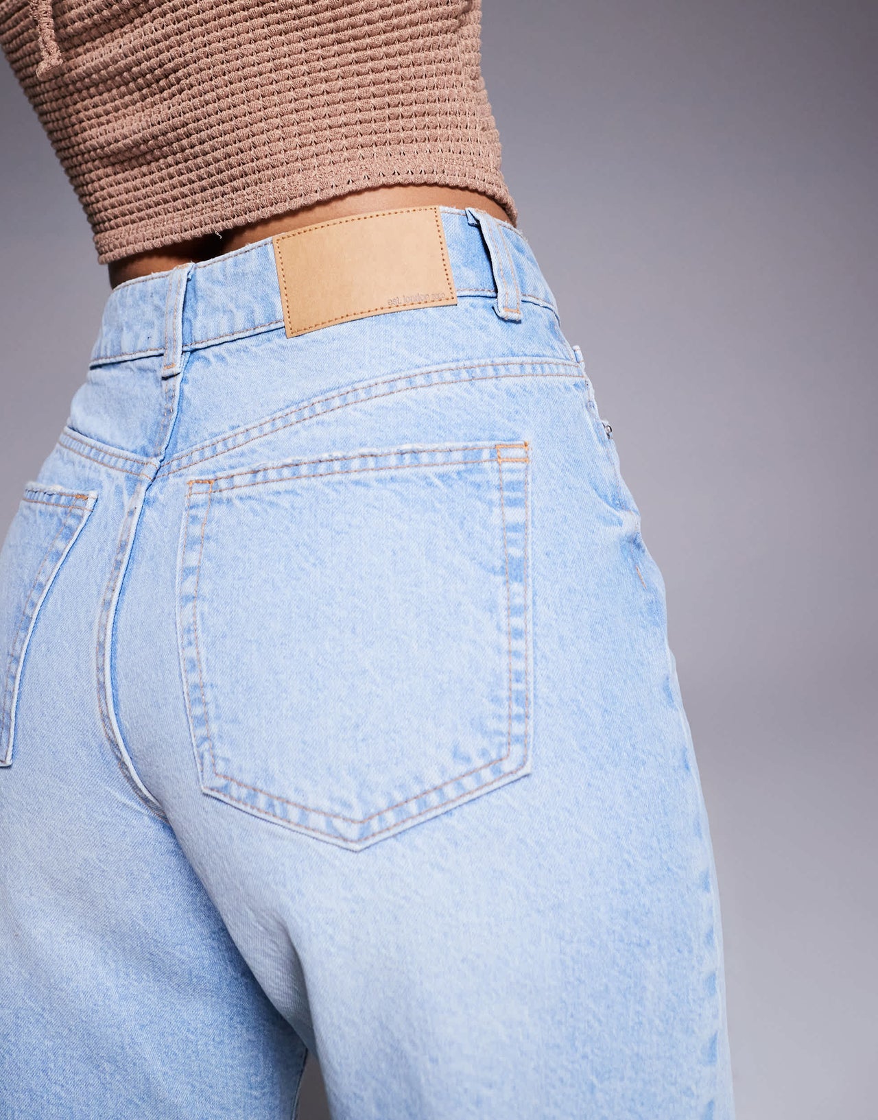 ASOS DESIGN denim bermuda short with rips in pale wash