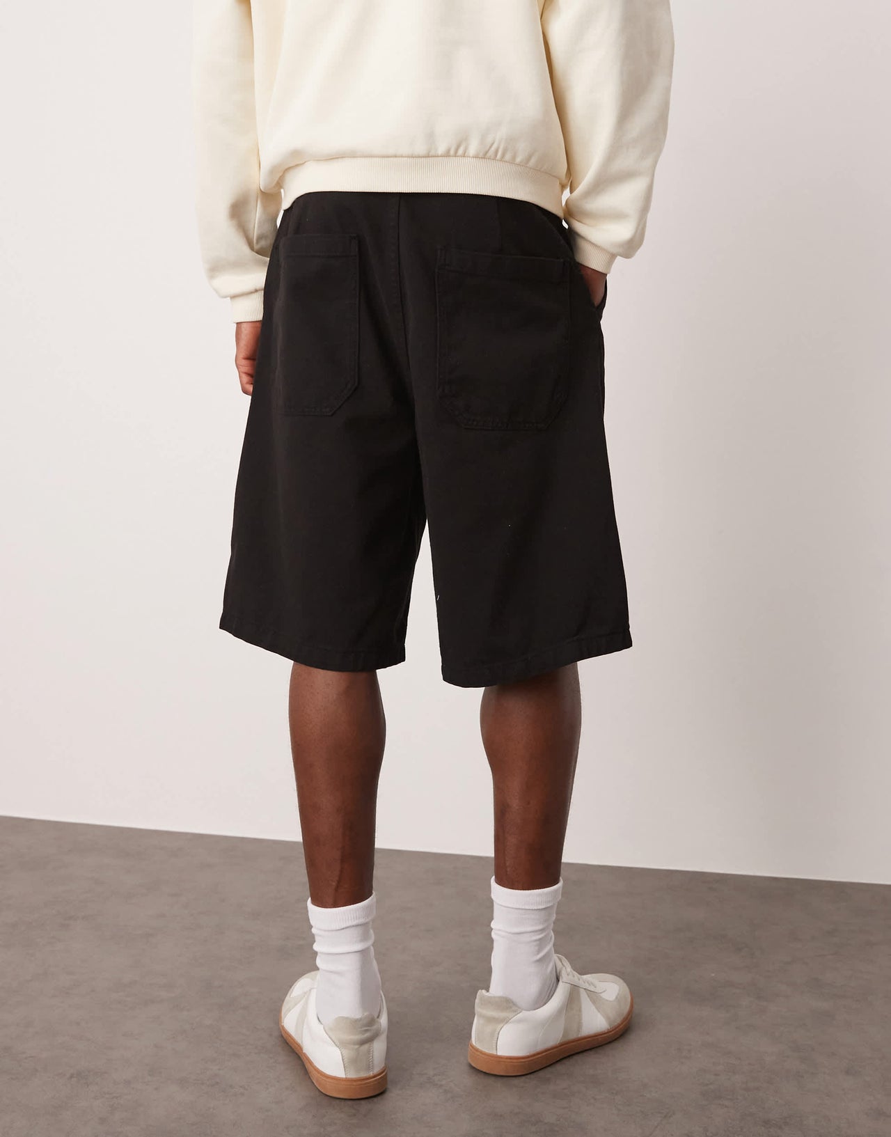 ASOS DESIGN long length pleated shorts in black