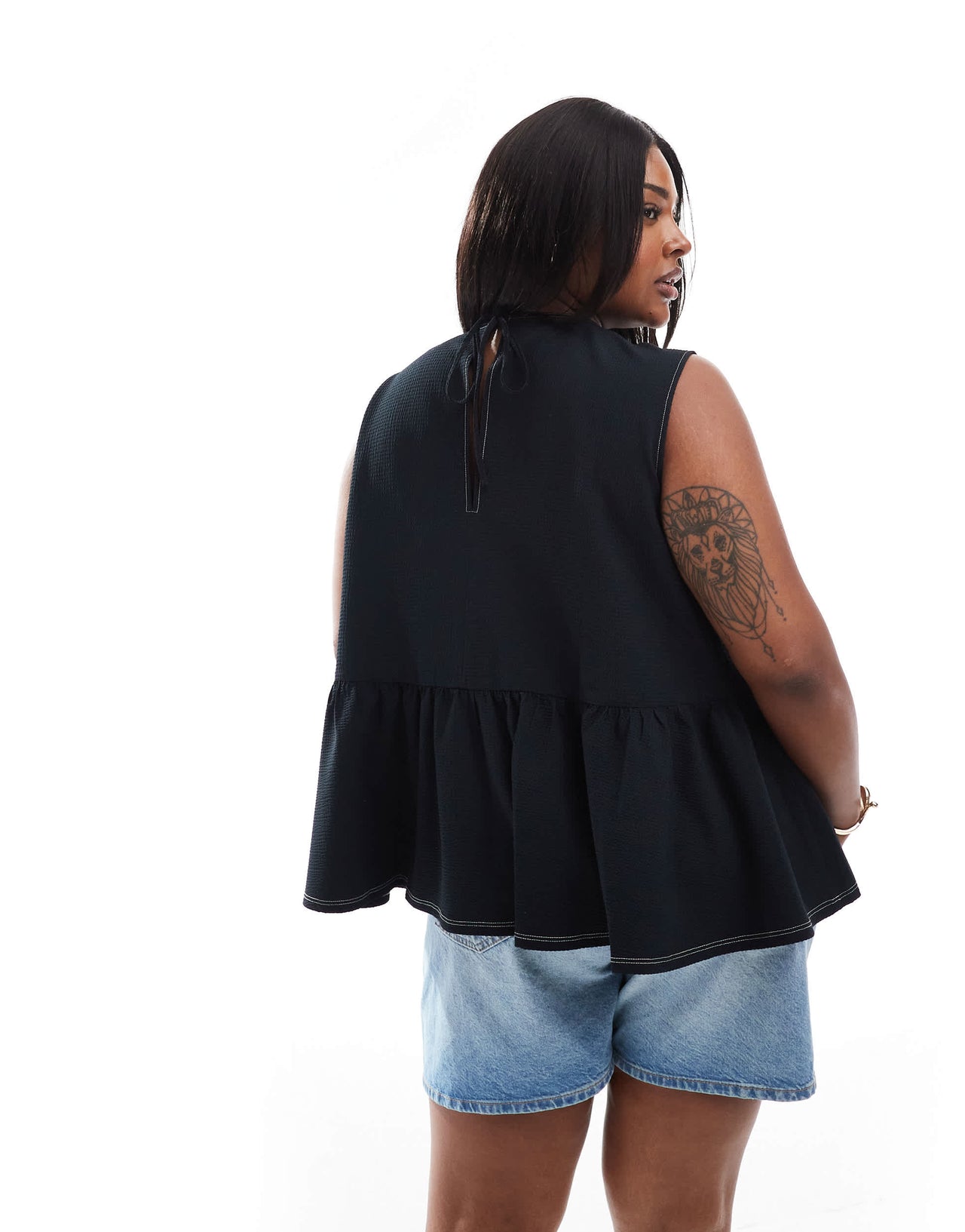 ASOS DESIGN Curve sleeveless peplum top with tie back in black