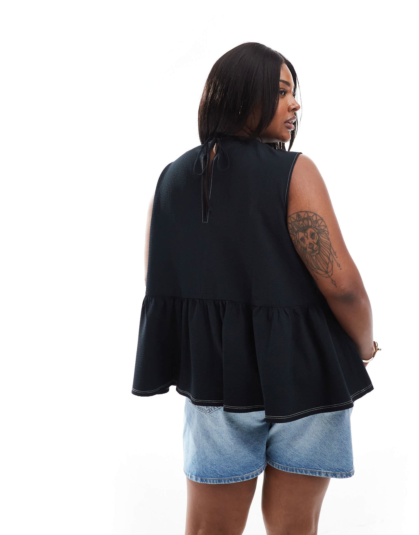 ASOS DESIGN Curve sleeveless peplum top with tie back in black