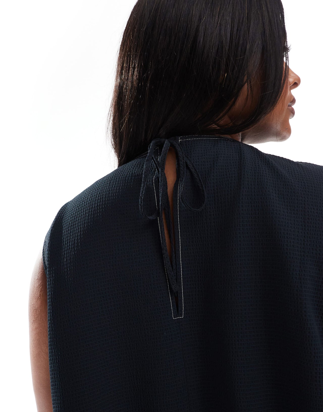ASOS DESIGN Curve sleeveless peplum top with tie back in black