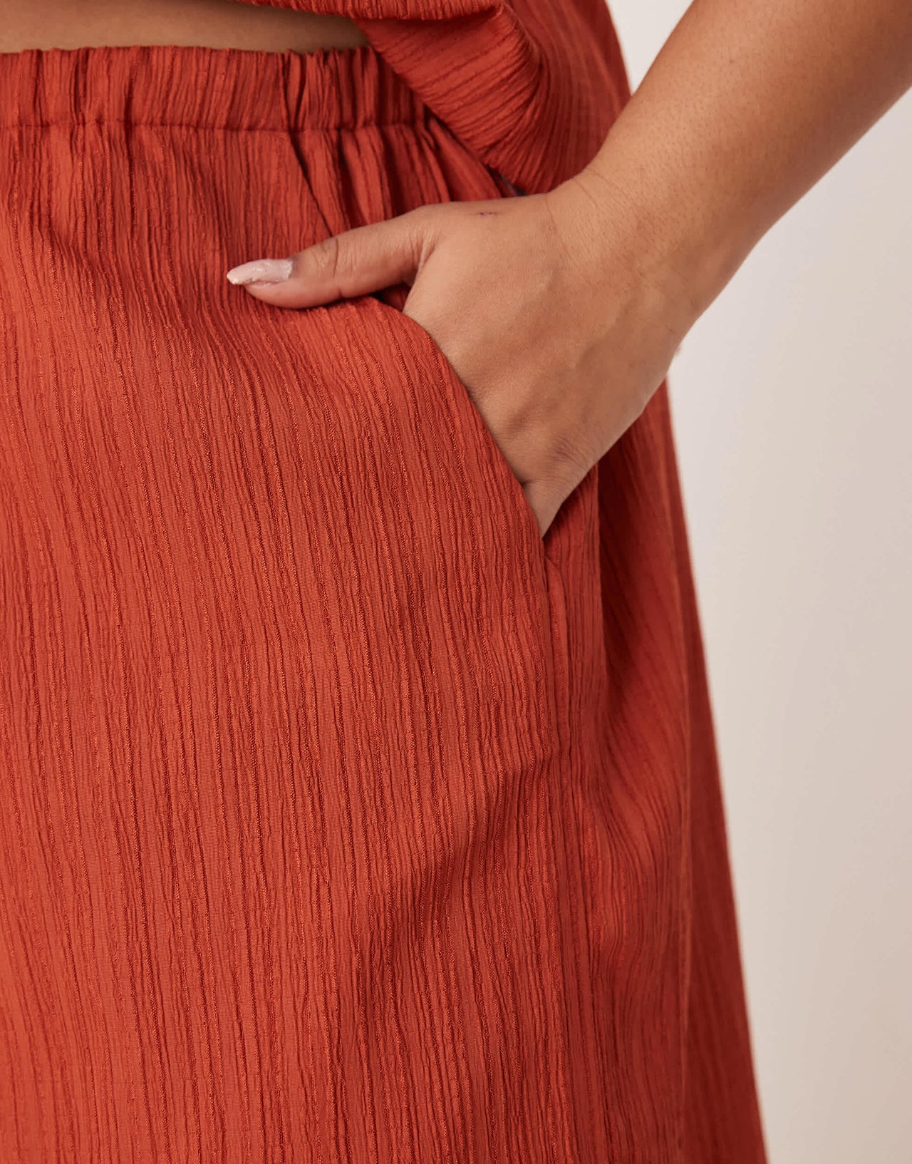 ASOS DESIGN Curve crinkle palazzo trousers co-ord in rust