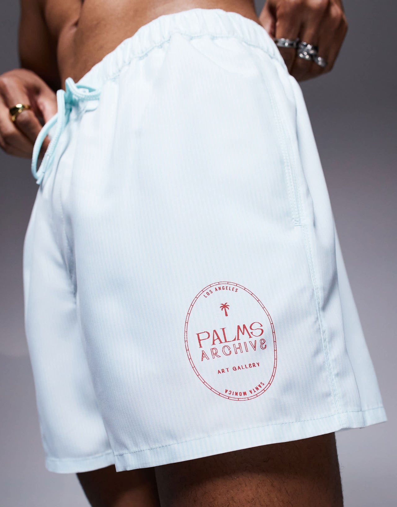 ASOS DESIGN swim shorts in short length in blue and white stripe