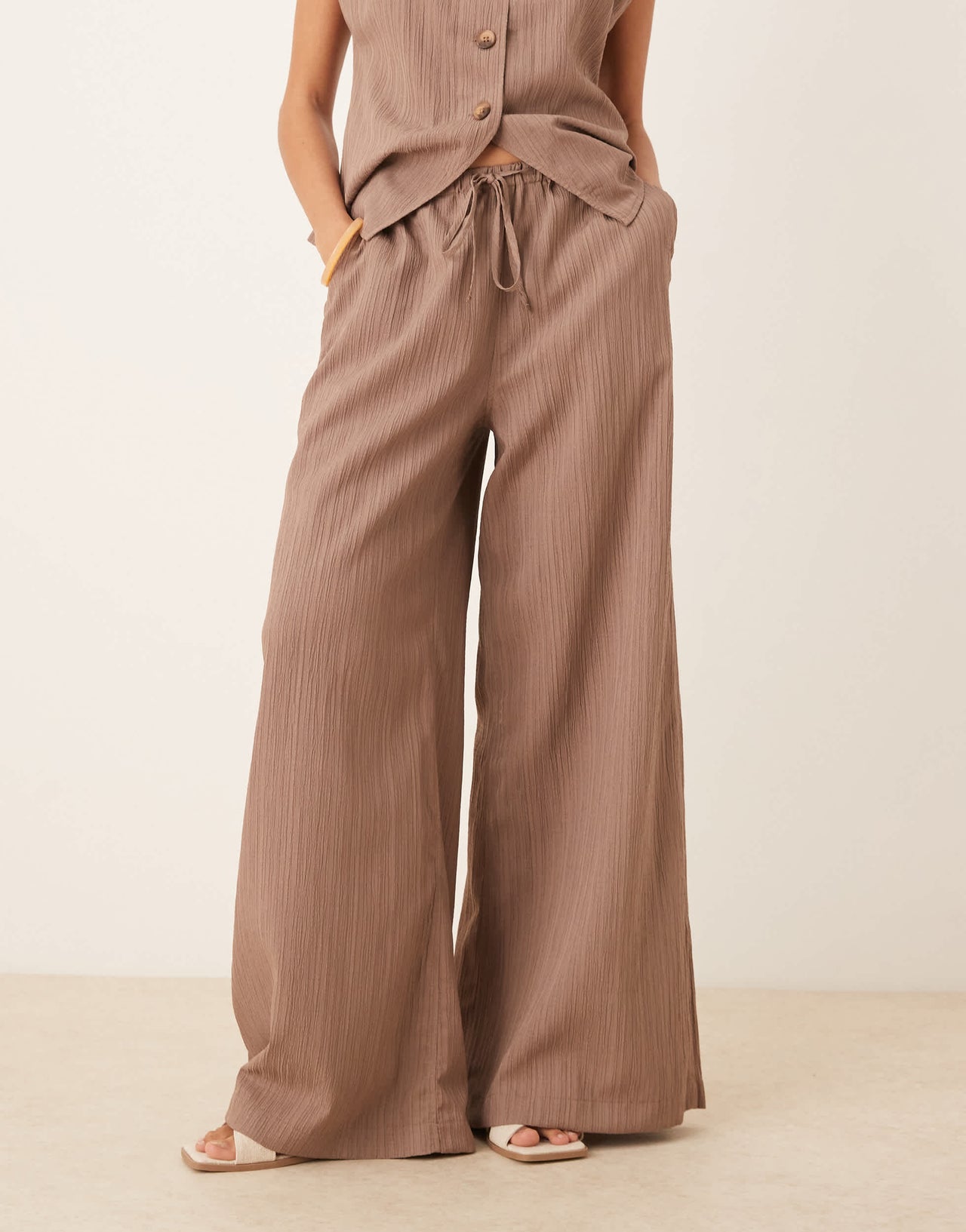 ASOS DESIGN crinkle palazzo trousers co-ord in taupe