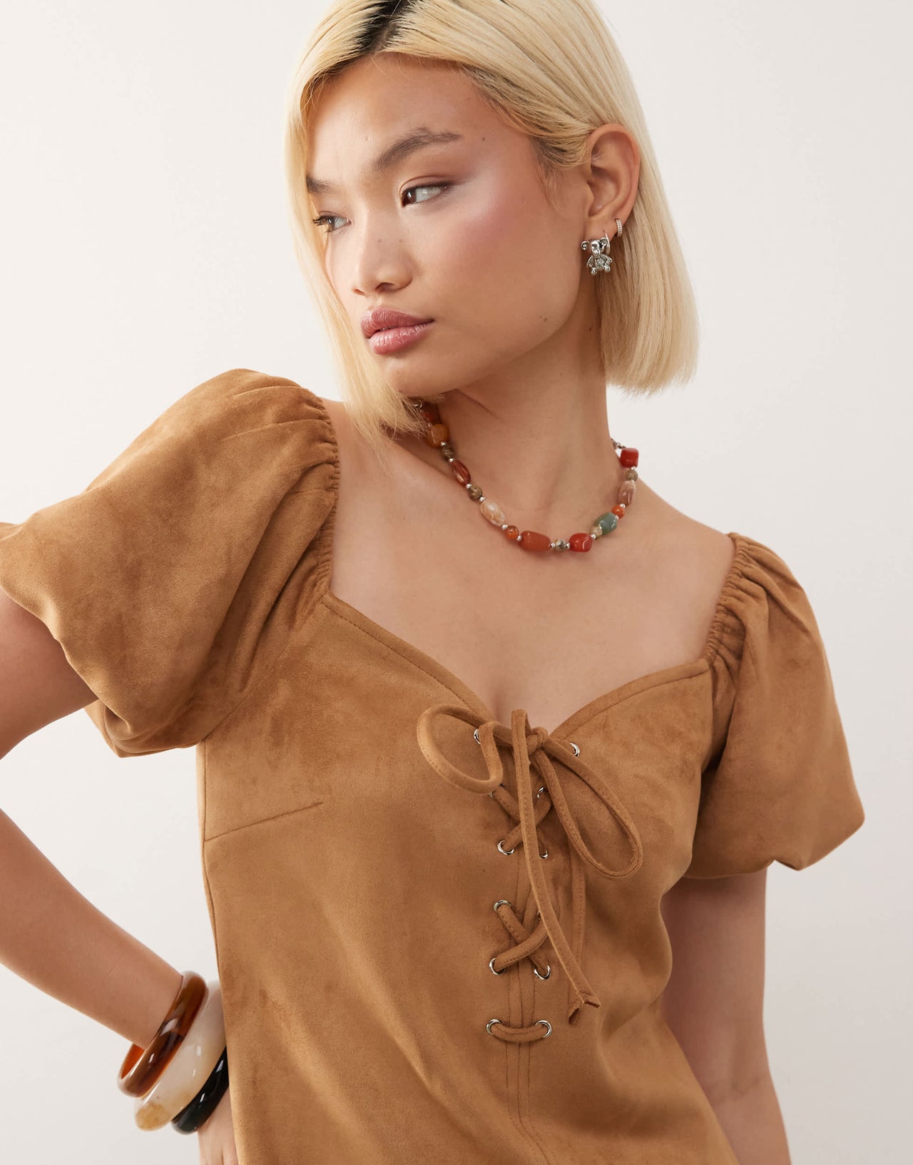 Reclaimed Vintage festival lace up faux suede mini dress in tan