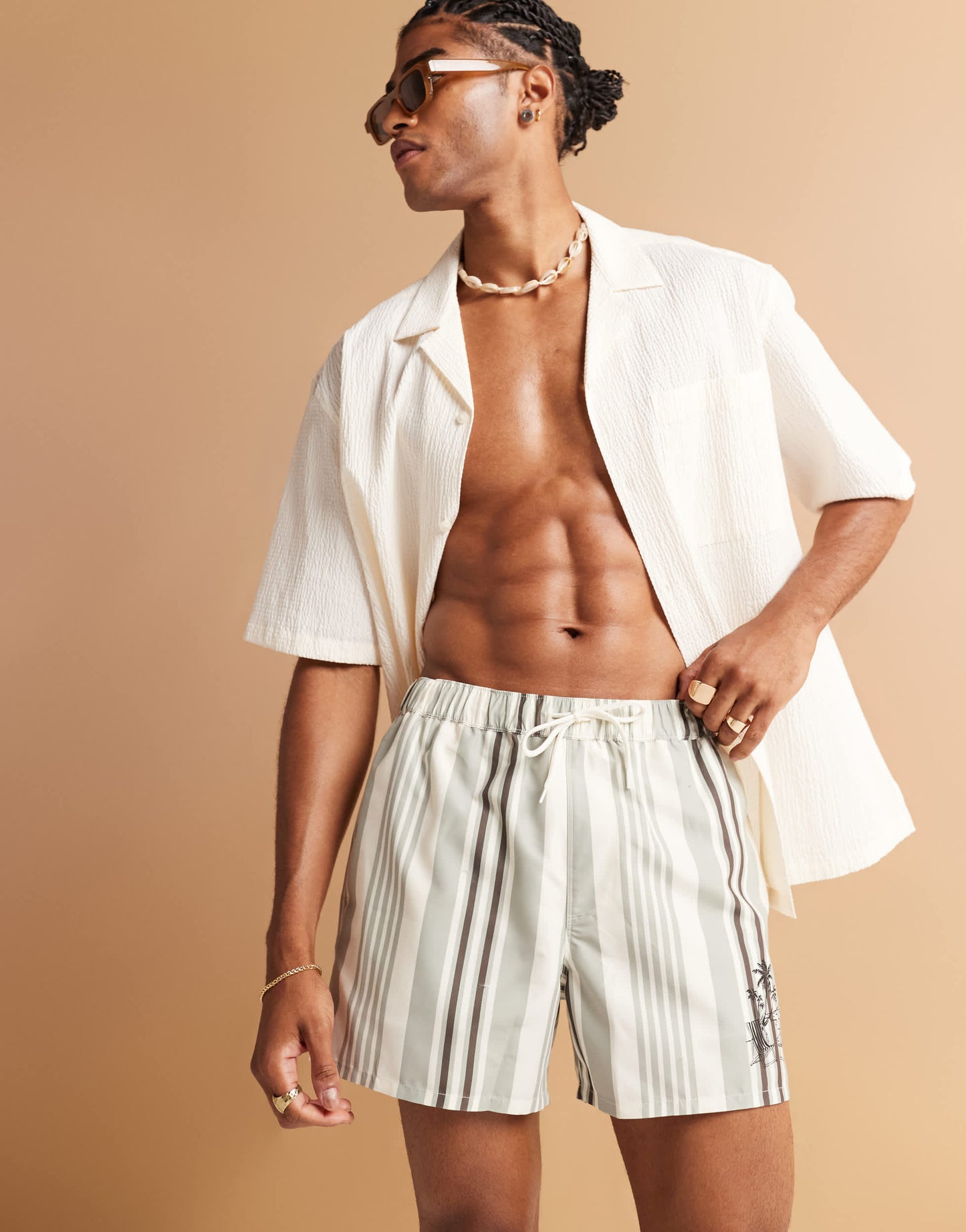 ASOS DESIGN swim shorts in short length in cream stripe with placement print