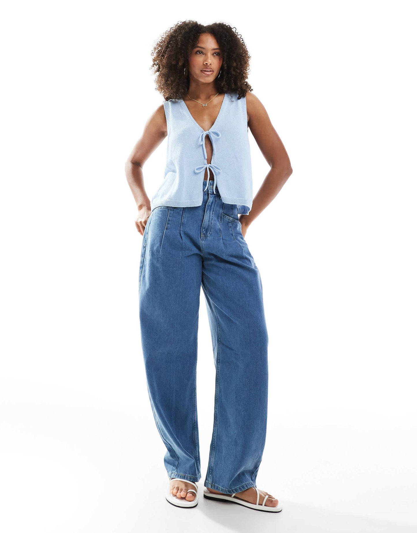 ASOS DESIGN v neck knitted tank top with bow tie front in light blue