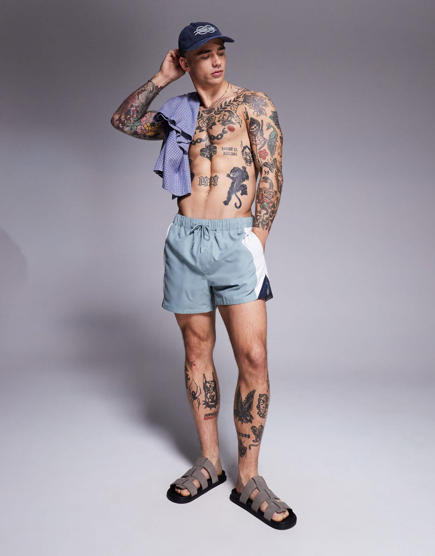 ASOS DESIGN swim shorts in short length with side vent cut and sew in blue