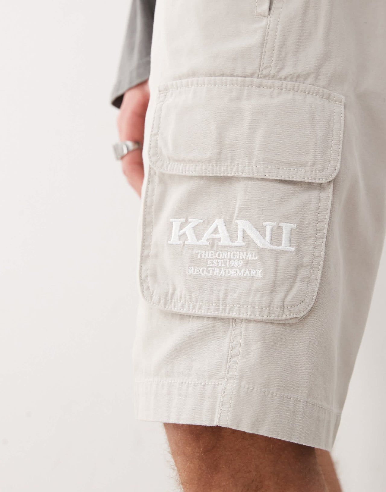 Karl Kani retro washed cargo shorts in off white