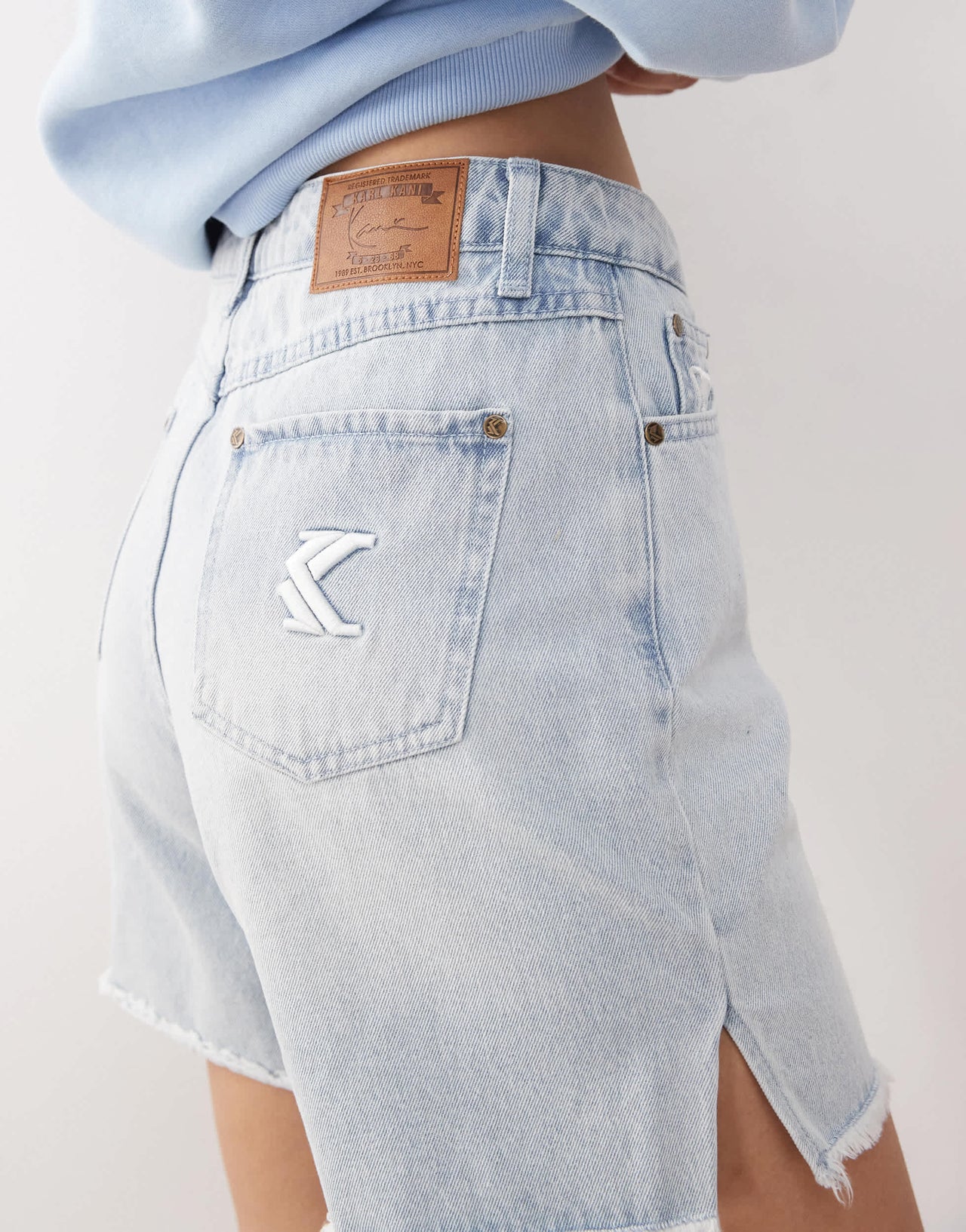 Karl Kani OG slit denim shorts in light wash blue