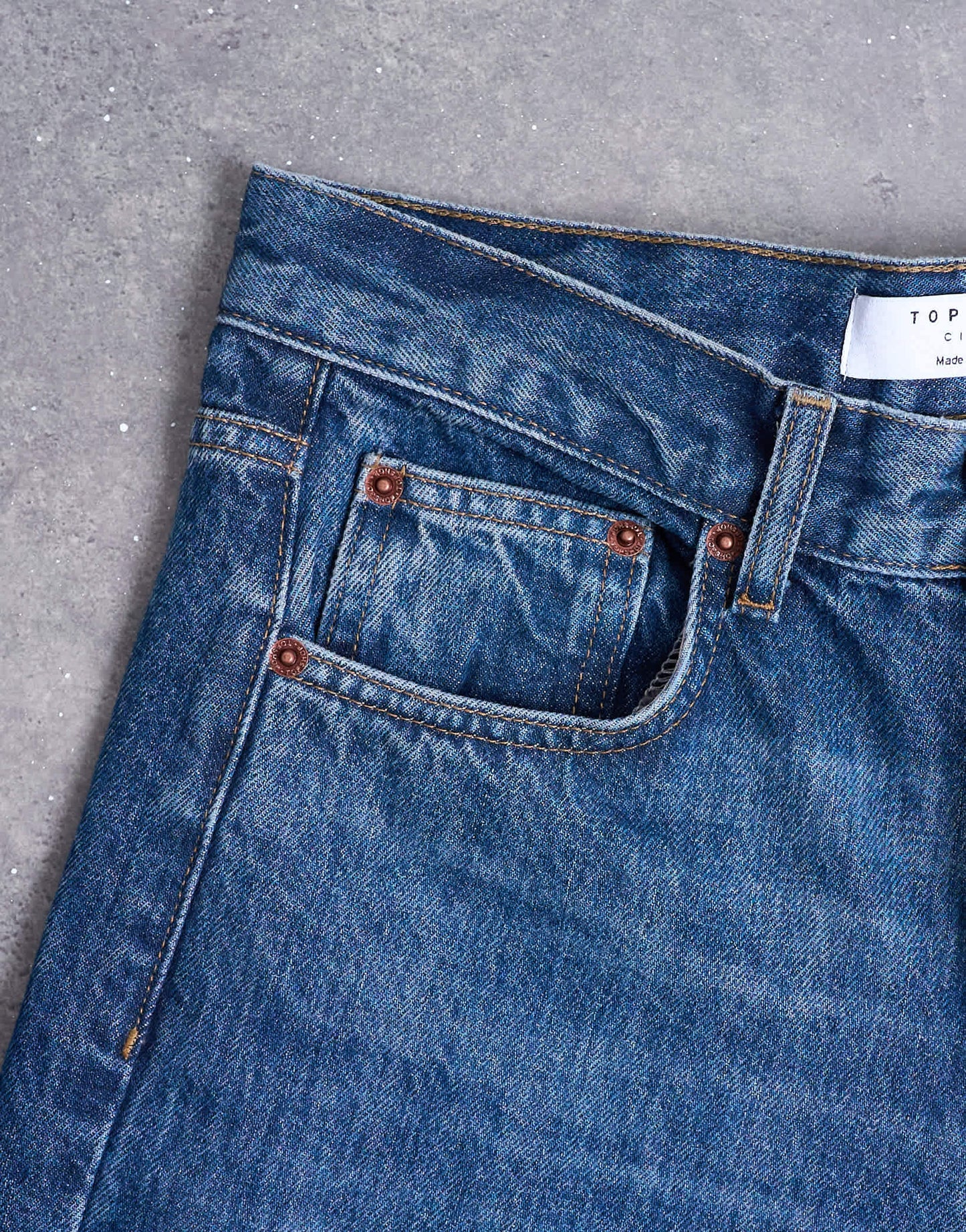 Topshop Cinch low rise jeans in dark stone wash